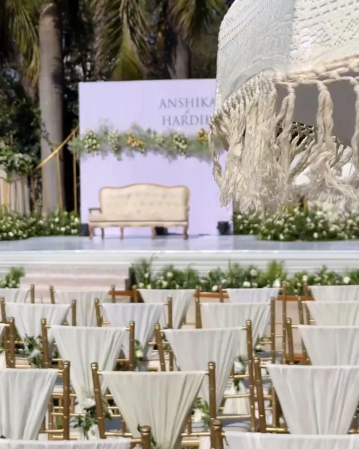 A fairytale wedding stage and aisle dressed in white florals